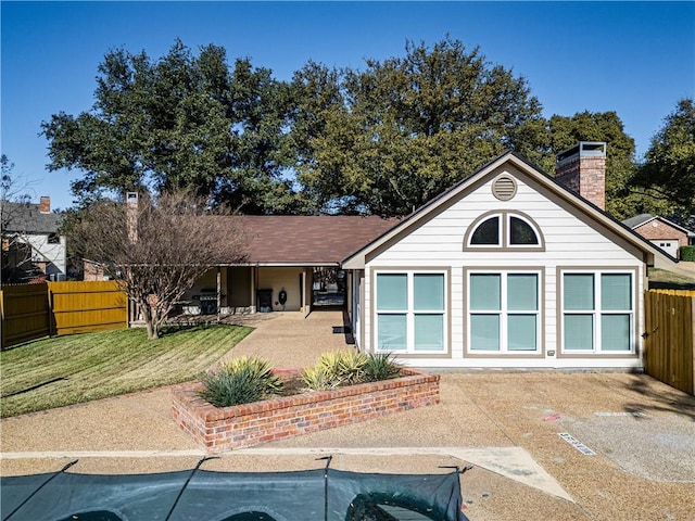 ranch-style house featuring a patio area and a front lawn