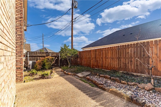 view of yard featuring a patio area and central AC