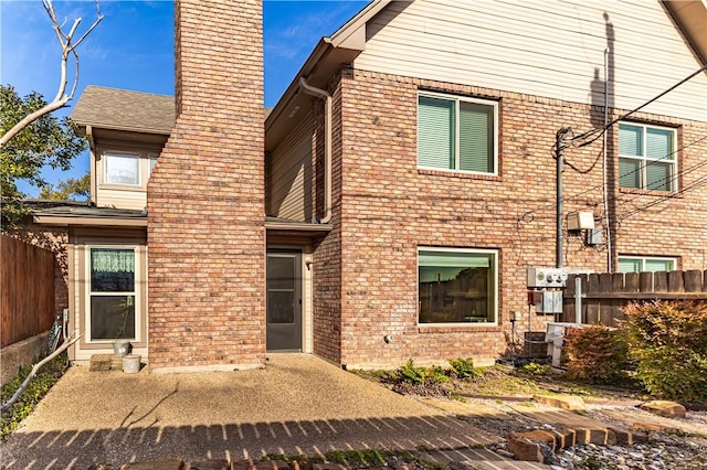 back of property featuring a patio area