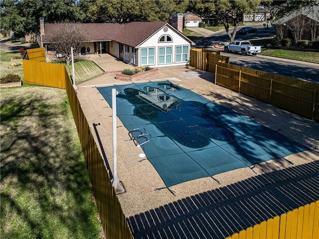 view of swimming pool with a patio area