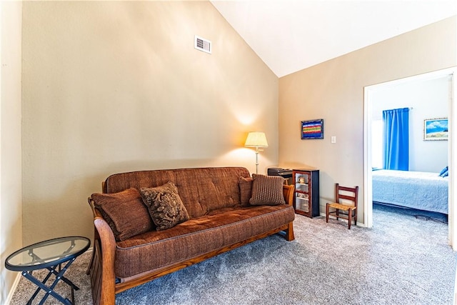 living room with carpet floors and vaulted ceiling