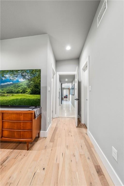 hall with light hardwood / wood-style flooring