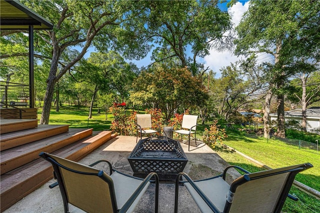 view of patio / terrace with an outdoor fire pit