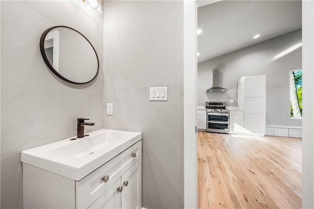 bathroom featuring vanity and hardwood / wood-style flooring