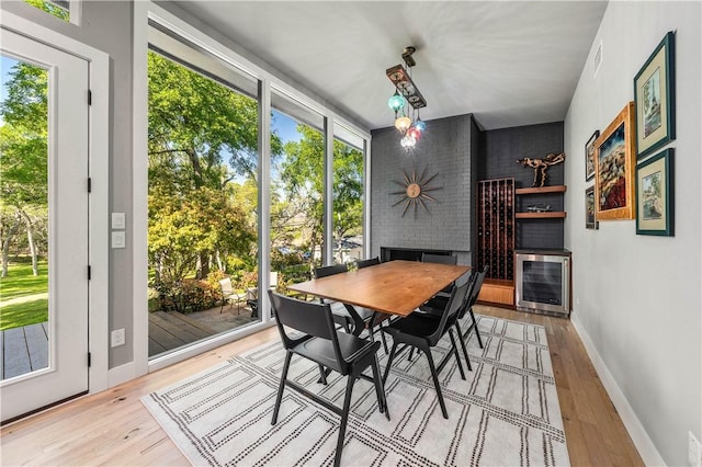 dining room featuring heating unit and light hardwood / wood-style flooring