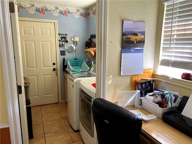 laundry room featuring light tile patterned flooring and washer and dryer