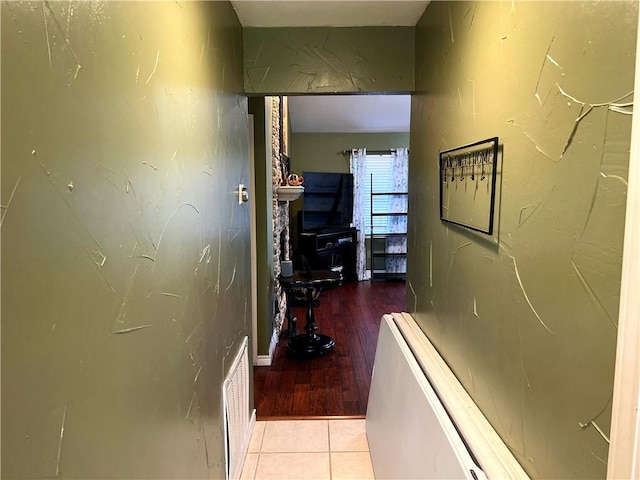 hallway with light tile patterned floors