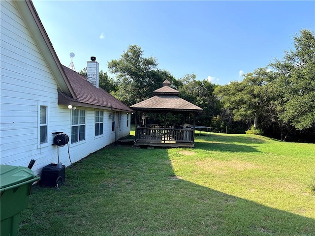 view of yard featuring a gazebo and a wooden deck