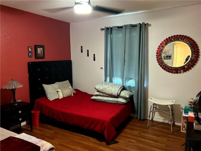 bedroom featuring ceiling fan and wood-type flooring