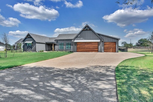 view of front of house with a garage and a front yard