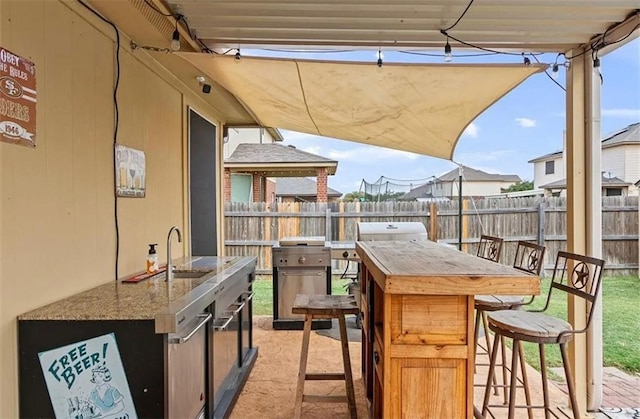 view of patio featuring a wet bar