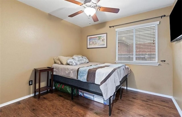 bedroom featuring ceiling fan and dark hardwood / wood-style floors