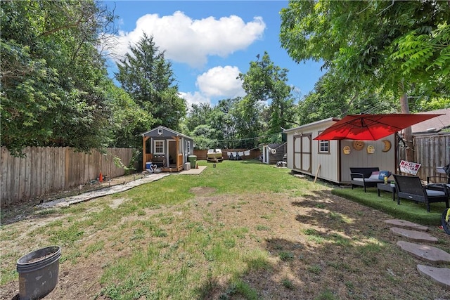 view of yard featuring a storage unit