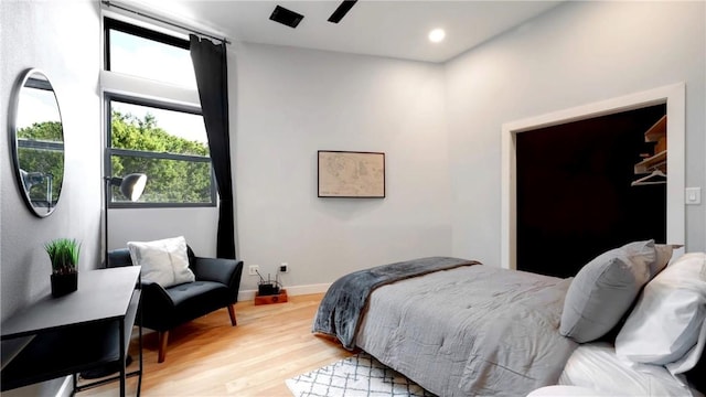 bedroom with hardwood / wood-style floors