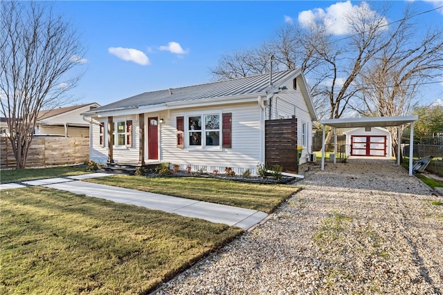 view of front of house featuring a front yard and a carport