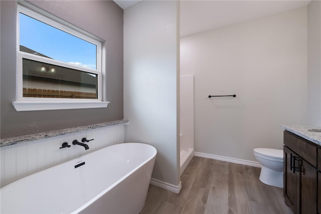 full bathroom featuring hardwood / wood-style floors, vanity, toilet, and shower with separate bathtub