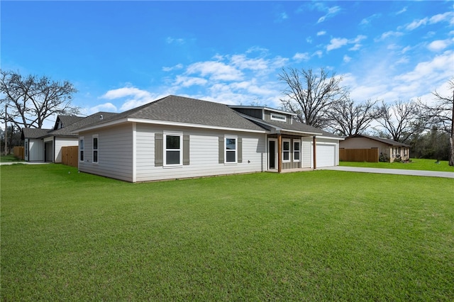 view of front of home featuring a garage and a front lawn