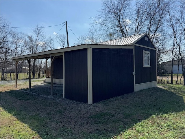 view of outbuilding with a lawn