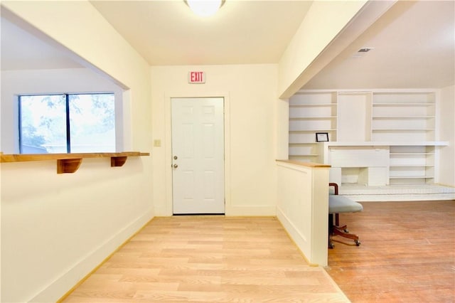 office with light hardwood / wood-style floors