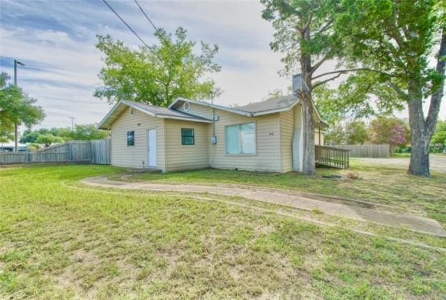 back of house with a yard