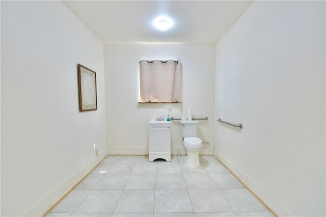 bathroom featuring tile patterned floors and toilet