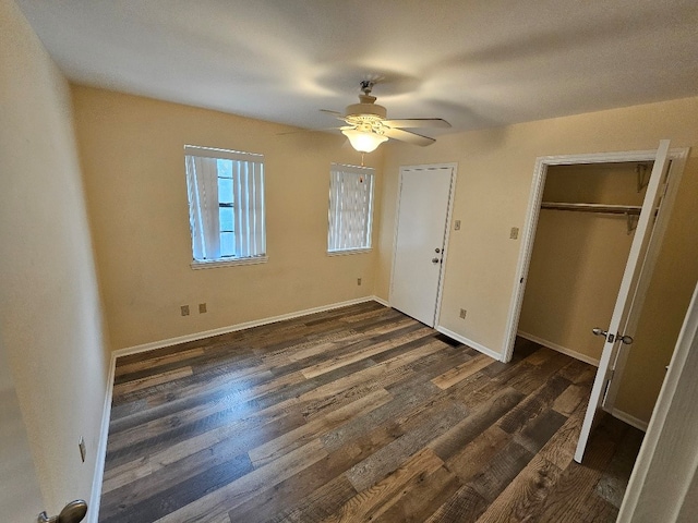 unfurnished bedroom featuring dark hardwood / wood-style floors and ceiling fan