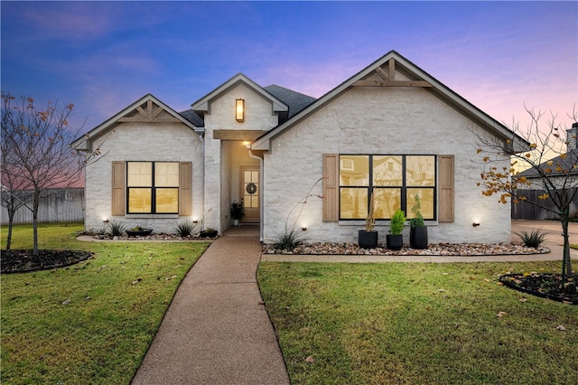 view of front of home featuring a lawn