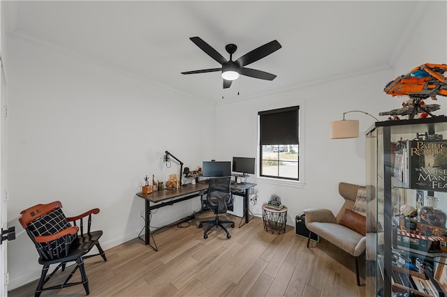 office area with light hardwood / wood-style floors, ceiling fan, and crown molding