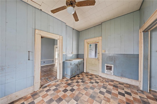 washroom with heating unit and ceiling fan