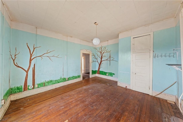 unfurnished dining area with hardwood / wood-style flooring