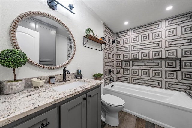 bathroom featuring hardwood / wood-style floors, vanity, and toilet