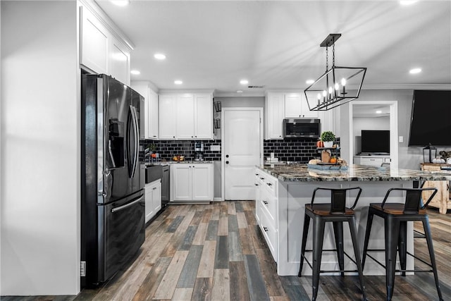 kitchen featuring white cabinetry, dark wood-type flooring, and black refrigerator with ice dispenser