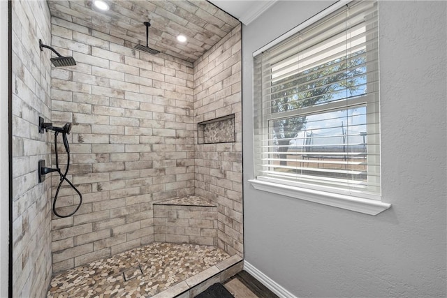 bathroom with tiled shower