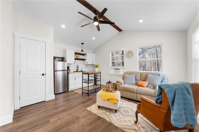 living area with dark wood-style floors, recessed lighting, lofted ceiling with beams, ceiling fan, and baseboards