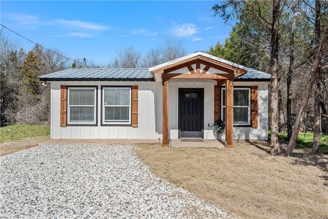 view of front of home featuring metal roof and board and batten siding