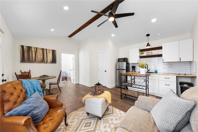 living area with recessed lighting, vaulted ceiling with beams, baseboards, and wood finished floors