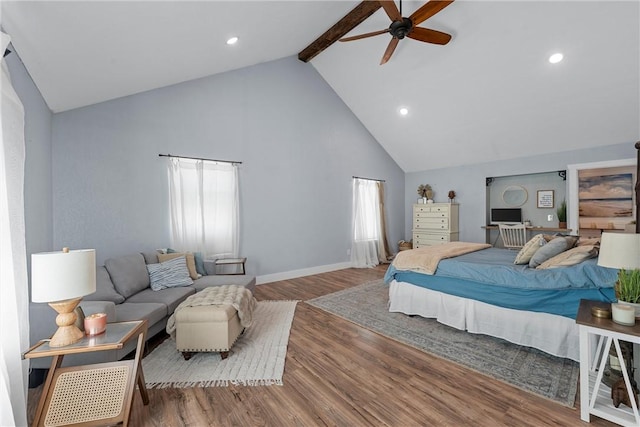 bedroom with high vaulted ceiling, beam ceiling, baseboards, and wood finished floors