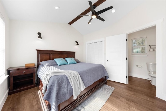 bedroom with baseboards, lofted ceiling, wood finished floors, a closet, and recessed lighting