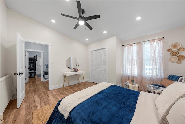 bedroom featuring light wood finished floors, baseboards, ceiling fan, vaulted ceiling, and recessed lighting