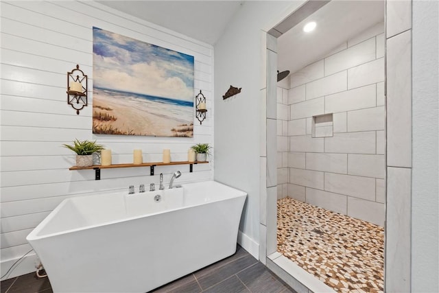 full bathroom with a freestanding bath and tiled shower