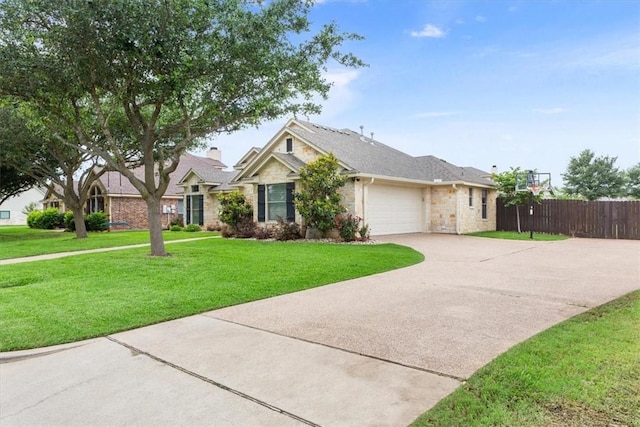 view of front of home with a garage and a front yard