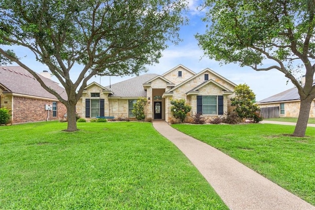 craftsman-style home with a front yard