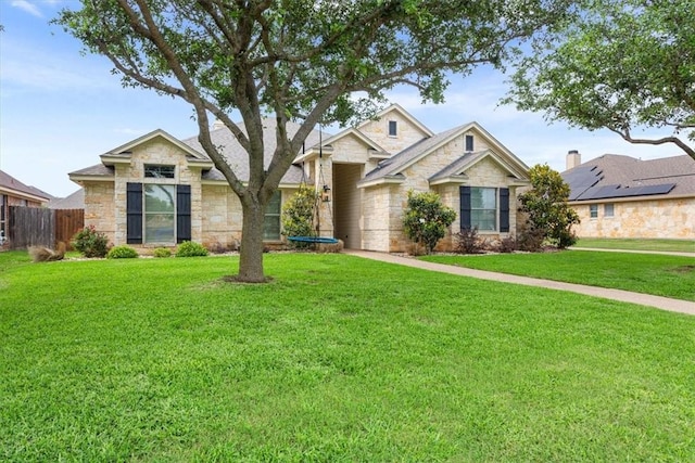 craftsman-style home with a front yard