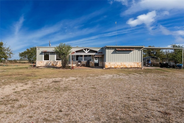 view of front of house featuring a carport