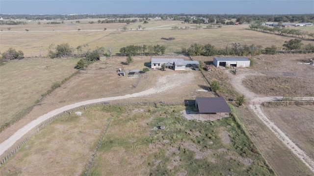 birds eye view of property featuring a rural view