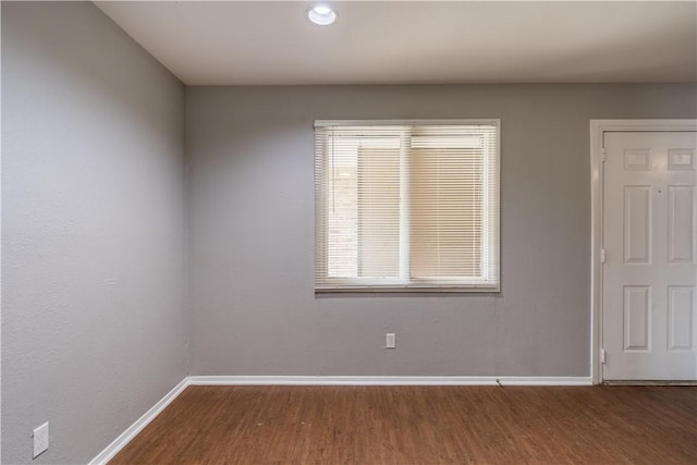 unfurnished room featuring wood-type flooring