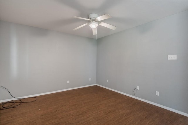 empty room featuring dark hardwood / wood-style floors and ceiling fan