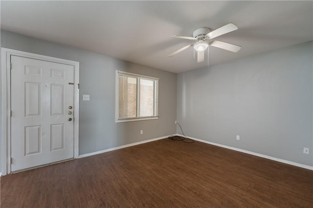 entryway with dark hardwood / wood-style flooring and ceiling fan