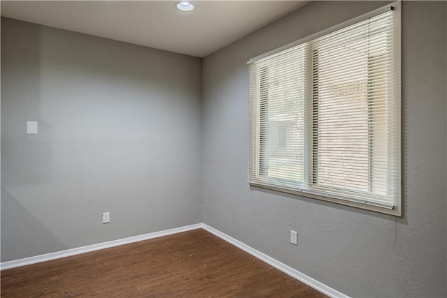 unfurnished room featuring hardwood / wood-style floors