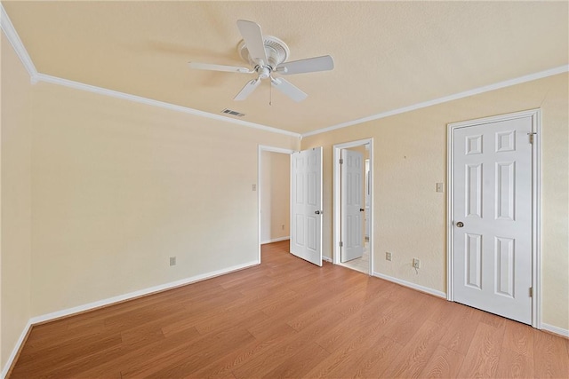 unfurnished bedroom with ceiling fan, light hardwood / wood-style flooring, and crown molding